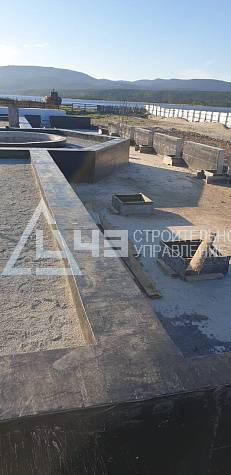 Delivery of house kits and the start of construction of the recreation center